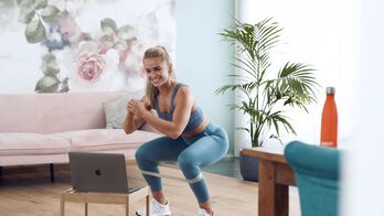 Girl working out at home with On demand classes