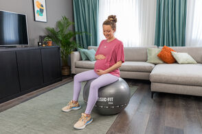 Pregnant women sitting on ball