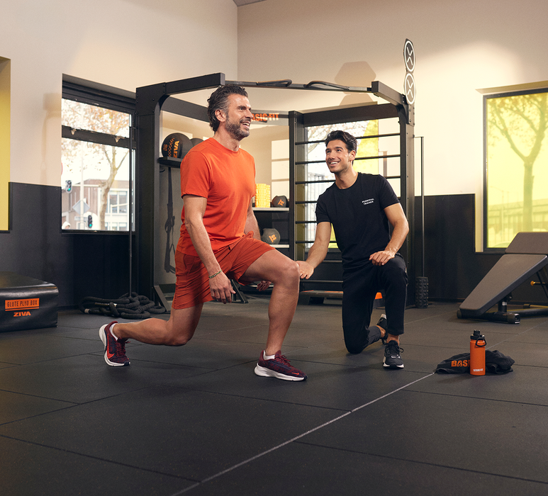 Personal trainer coaching a member