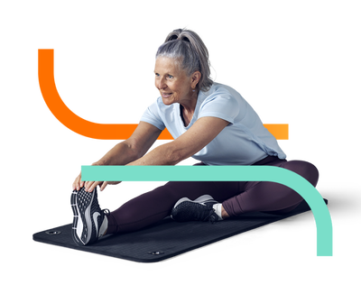 older lady stretching on fitness matt